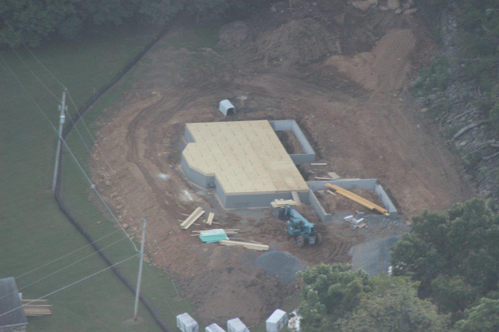 Here's a nice shot of the job site.  The foundation with the floor platform are in place and ready for the logs to be laid.