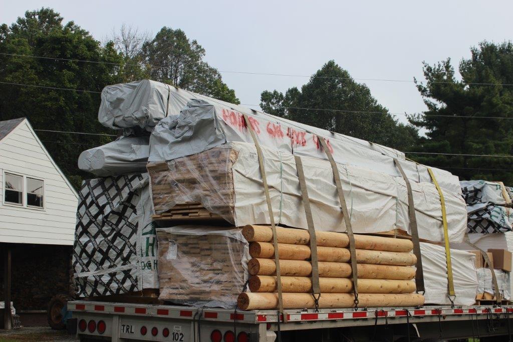 This is the 1st of 3 truckloads of logs and other materials that are shipped from the mill.  We'll typically see some of the interior paneling on the 1st load so that the pine can be dried on-site.